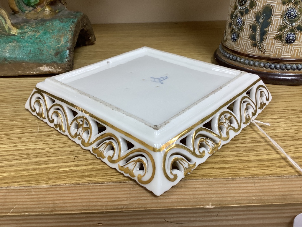 A Sevres square putti decorated dish, 15cm sq.